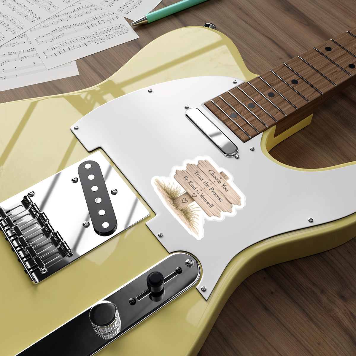 Wooden beach sign quote sticker displayed on the body of an electric guitar