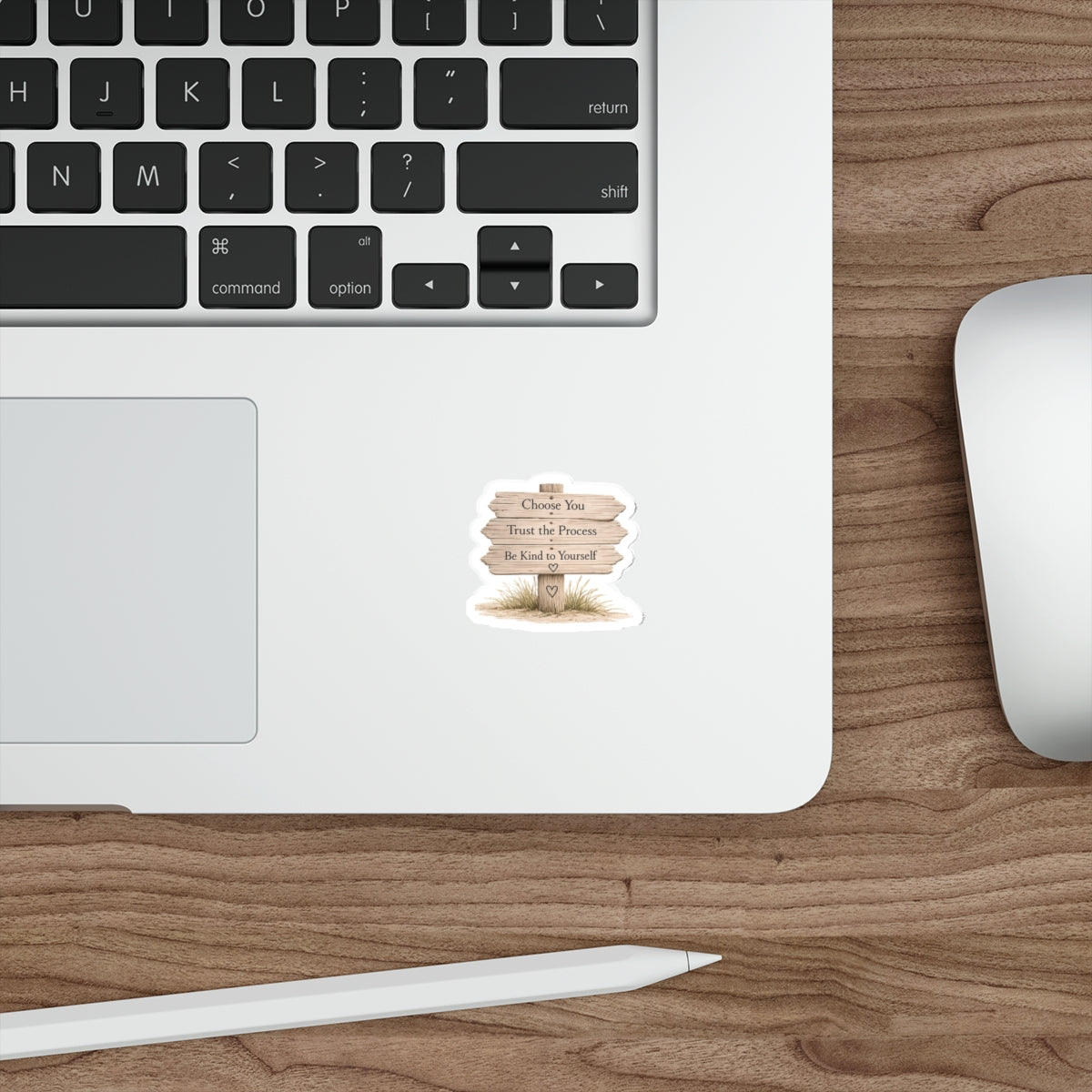 Wooden beach sign quote sticker displayed on a silver laptop